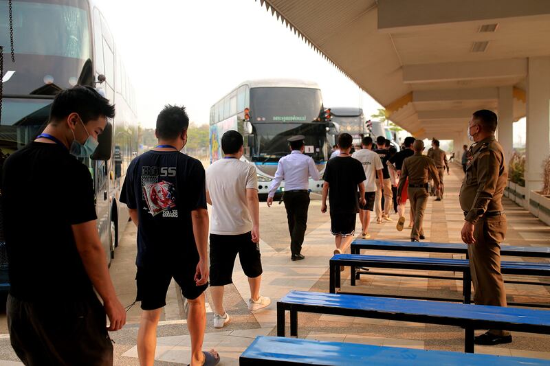 Alleged scam center workers and victims from China arrive at the Thai-Myanmar border checkpoint in Myanmar's Myawaddy township on Feb. 20, 2025.