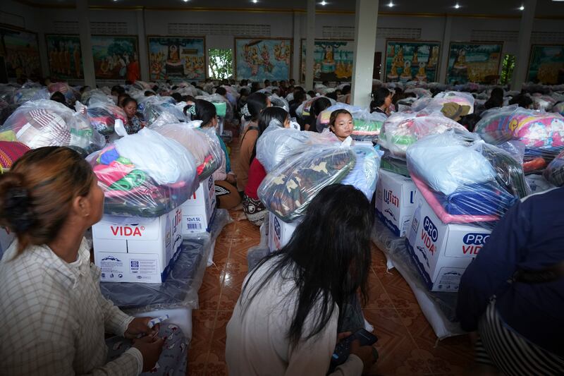 Local villagers wait to receive supplies donated by a charity in Srey Snam district, Siem Reap province, Cambodia, July 28, 2025, amid the fighting between Thailand and Cambodia.