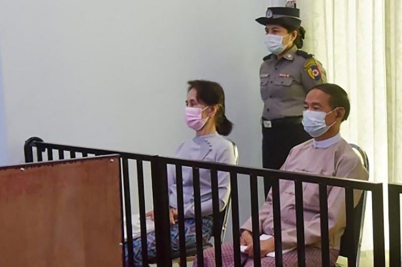 Detained Myanmar State Councilor Aung San Suu Kyi (L) and president Win Myint (R) during their first court appearance in Naypyidaw,  May 24, 2021.