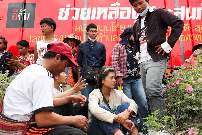Migrant workers wait for an update on their colleagues and friends who were working at a building that collapsed following a strong earthquake, in Bangkok, Thailand, March 29, 2025.