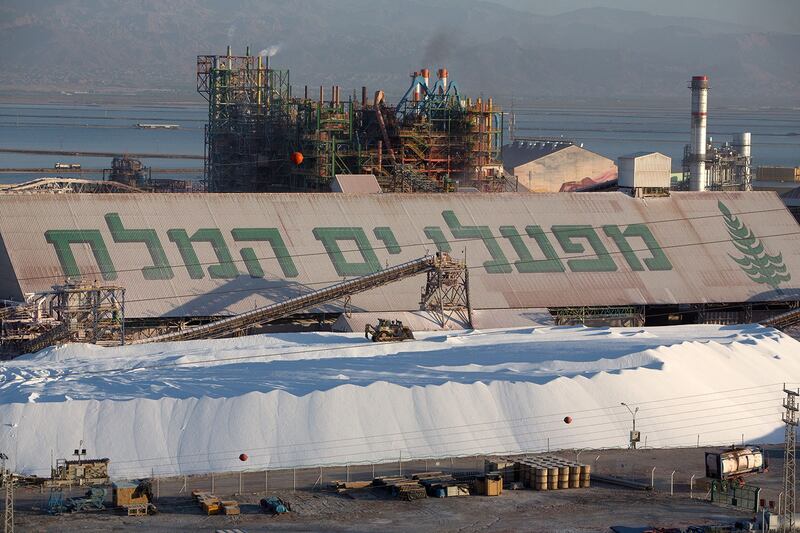 A bulldozer works on a large hill of potash at the Dead Sea Works in Israel's Sodom area, Feb. 16, 2016. (Menahem Kahana/AFP)