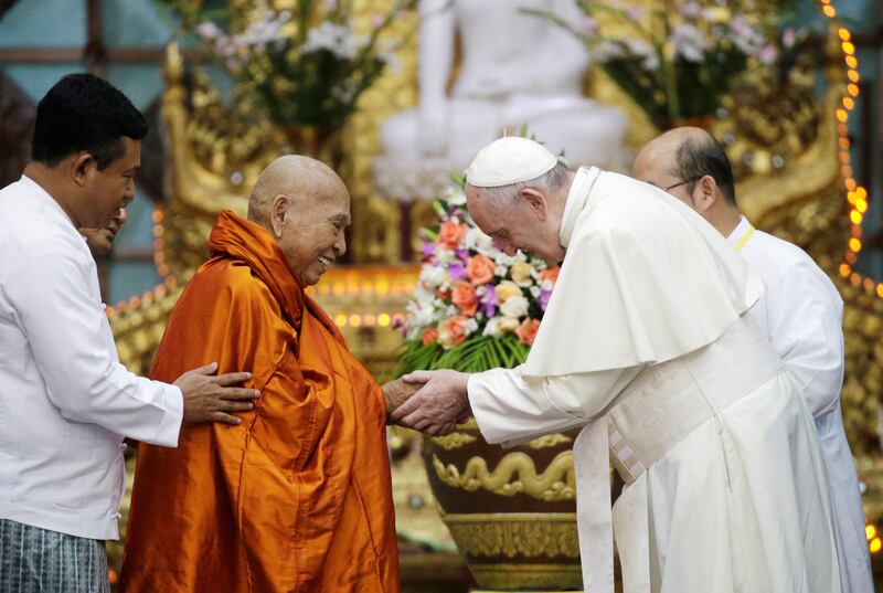 Pope Francis shakes hands with Bhaddanta Kumarabhivasma, chairman of the state Sangha Maha Nayaka Committee, during a meeting with the Buddhist committee in Yangon, Myanmar Nov. 29, 2017.