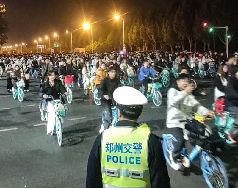 Thousands of students participate in a bike ride to Kaifeng, in search of soup dumplings, causing a highway to be clogged in Zhengzhou, Henan, China, Nov. 9, 2024.