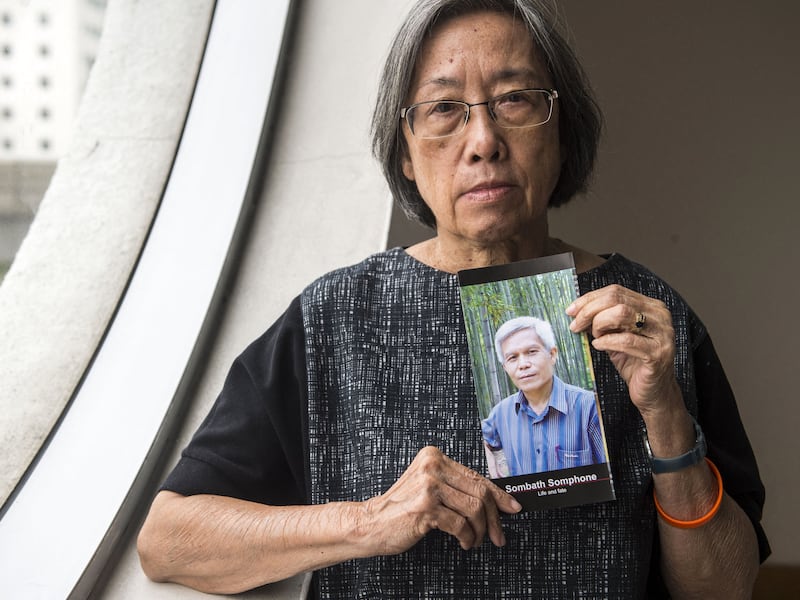 Shui-Meng Ng holds a picture of her missing Laos husband Sombath Somphone, an environmental campaigner, in Bangkok, Dec. 12, 2018.